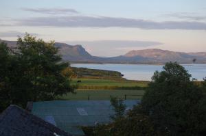 a view of a body of water with mountains at Ardtarmon Garden Cottage in Sligo +11 photos