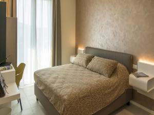 Voodi või voodid majutusasutuse Hotel Buena Onda toas