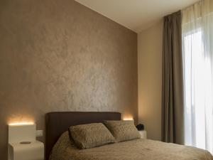 Voodi või voodid majutusasutuse Hotel Buena Onda toas