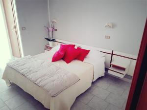Postel nebo postele na pokoji v ubytování Hotel Giannella