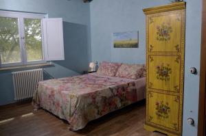 A bed or beds in a room at Rifugio Nel Bosco