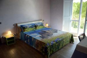 A bed or beds in a room at Rifugio Nel Bosco