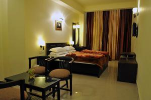 Voodi või voodid majutusasutuse Hotel Hong Kong Inn toas
