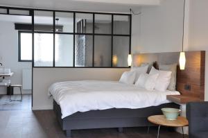 A bed or beds in a room at B&B Knokke