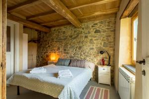 Postel nebo postele na pokoji v ubytování Casa Dafne
