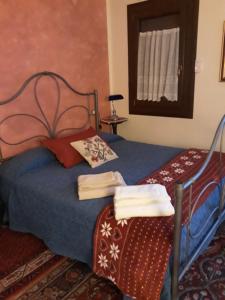 Een bed of bedden in een kamer bij Barone Rosso