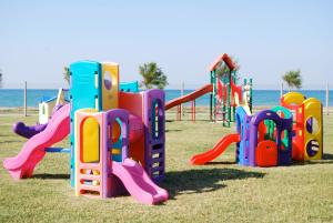 a park with a playground with a slide at Centro Vacanze Poker in Casalbordino