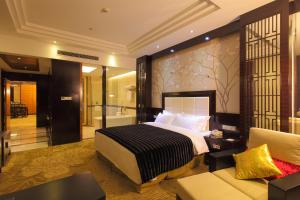 北京 カイ シェン シーン フェン インターナショナル ホテルにあるベッド