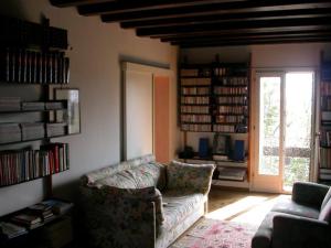 a living room with a couch and a window at Ca' Torcello in Venice