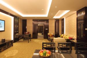 a lobby of a hotel with a living room at Beijing Kai Sheng Xing Feng International Hotel in Shunyi