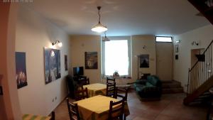 a living room with a table and a couch at La Casetta Di Atri in Atri