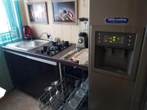 Apartament PLUSH Studio self check-in 24h tesisinde mutfak veya mini mutfak