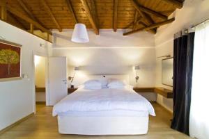 Posteľ alebo postele v izbe v ubytovaní Enastron Guesthouse