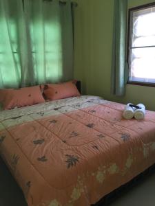 Кровать или кровати в номере Baan Kannika Hua Hin