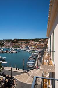 a view of a marina with boats in the water at Hotel Liautaud in Cassis