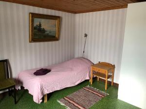 Vegby Bolsgård "Annexet" tesisinde bir odada yatak veya yataklar