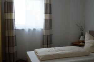 Postel nebo postele na pokoji v ubytování Augusta-Refugium
