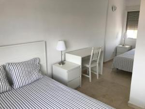 Posteľ alebo postele v izbe v ubytovaní Adosado en residencial