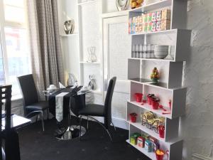 a dining room with a table and chairs at Four Seasons Guest House in Blackpool