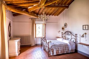Postel nebo postele na pokoji v ubytování Agriturismo Pieve Sprenna + 37 fotografií