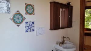 a bathroom with a sink and a mirror and a cabinet at Agriturismo La Torre Rossa in Itri +63 photos