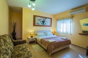 En eller flere senger på et rom på Dead Sea Sun Guest House