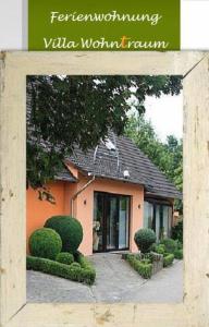 a book with a picture of a house at Ferienwohnung Villa Wohntraum in Varel