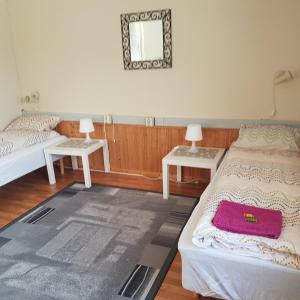 Postel nebo postele na pokoji v ubytování Wilhelmsen Romutleie