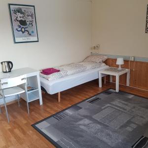 Postel nebo postele na pokoji v ubytování Wilhelmsen Romutleie