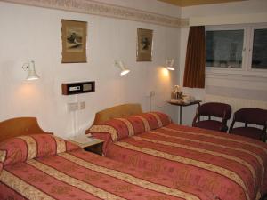 Krevet ili kreveti u jedinici u okviru objekta Lancaster Hotel