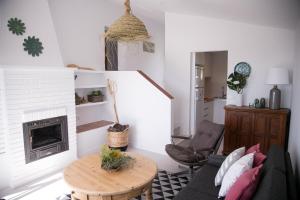 a living room with a couch and a table at Casa 2Mariposas in Mijas