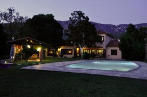 a swimming pool in the yard of a house at Anna's Mansion in Volos