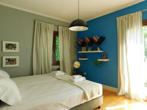 A bed or beds in a room at Anna's Mansion