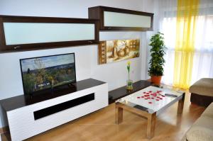 a living room with a television and a coffee table at Agustina Apartment in Alicante