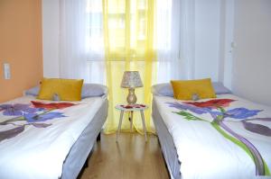 Postel nebo postele na pokoji v ubytování Agustina Apartment
