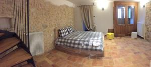 Кровать или кровати в номере appartamento pescocostanzo