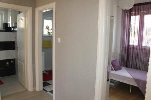 Postel nebo postele na pokoji v ubytování Apartmani Corleone