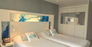 Cama ou camas em um quarto em Hôtel Josse