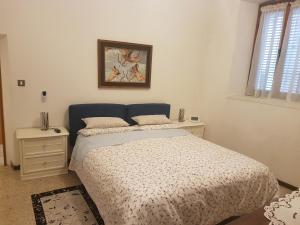 Ένα ή περισσότερα κρεβάτια σε δωμάτιο στο Appartamento Speranza