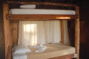 Cama o camas de una habitación en Cabañas Don Camilo Albergue de Montaña