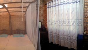Postel nebo postele na pokoji v ubytování Hikka Urban Stay