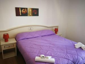 Postel nebo postele na pokoji v ubytování Hotel La Zorza