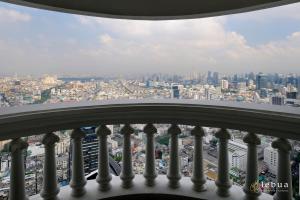 a view of the city from the balcony of a skyscraper at lebua at State Tower in Bangkok