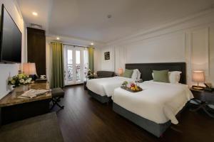 Voodi või voodid majutusasutuse Hanoi Allure Hotel toas