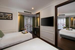 Voodi või voodid majutusasutuse Hanoi Allure Hotel toas
