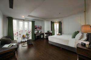 Voodi või voodid majutusasutuse Hanoi Allure Hotel toas