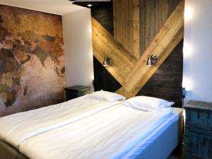 Tempat tidur dalam kamar di Havshotellet