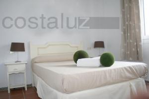 Ein Bett oder Betten in einem Zimmer der Unterkunft Apartamentos Aguadulce El Portil