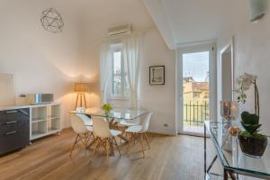 a dining room with a glass table and chairs at Apartments Florence - Fortezza in Florence