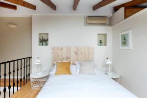 Postel nebo postele na pokoji v ubytování Dúplex Unico en Ópera - Palacio